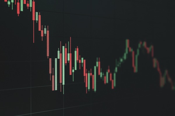Candlestick chart on a dark screen