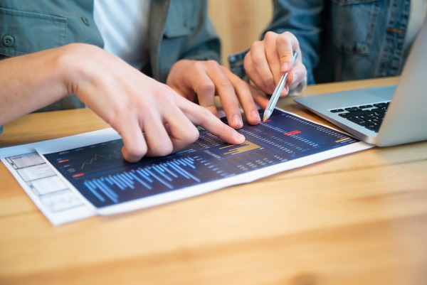 Colleagues reviewing a financial report