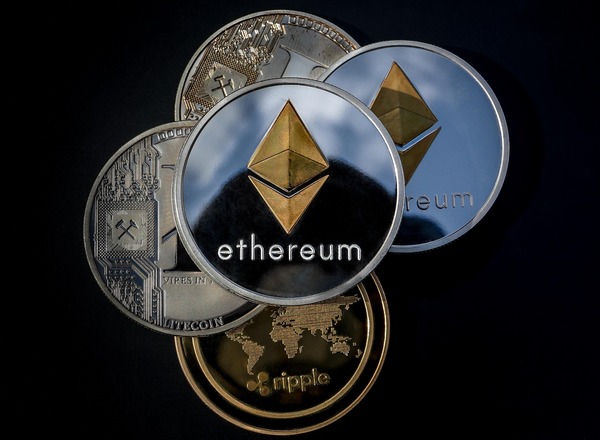 Ethereum coin on top of other crypto coins