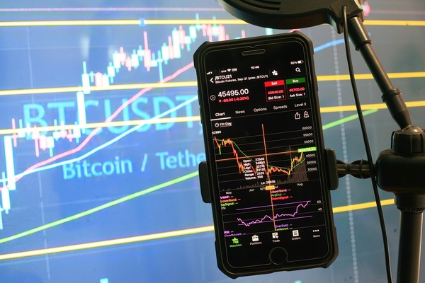 Smartphone showing a Bitcoin to Tether chart