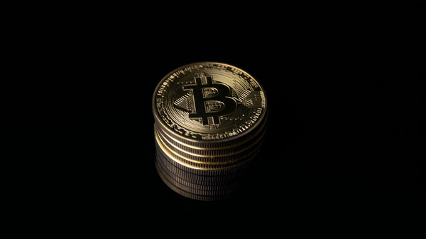 Stack of gold coins on a black background