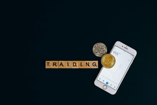 Trading letters with a smartphone and coins