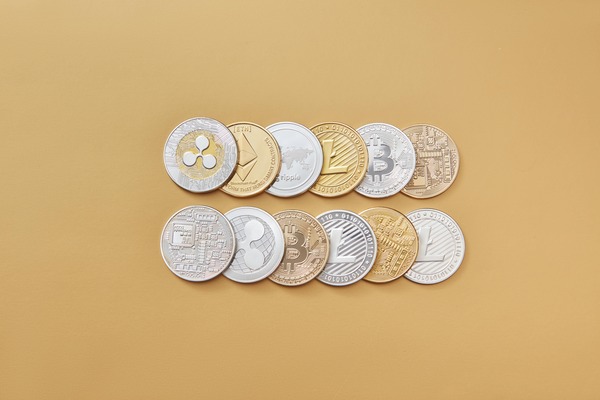 Two rows of silver and gold crypto coins