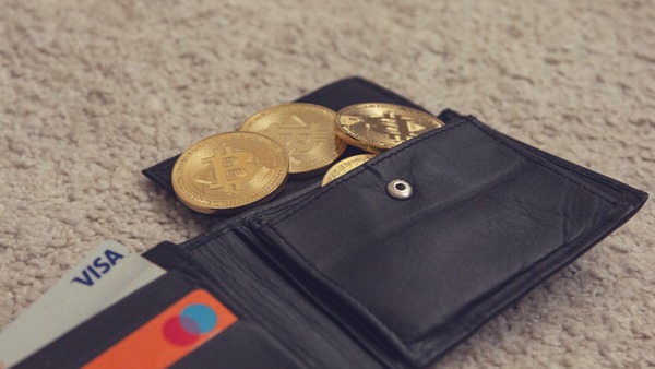 Wallet with Bitcoin coins and bank cards